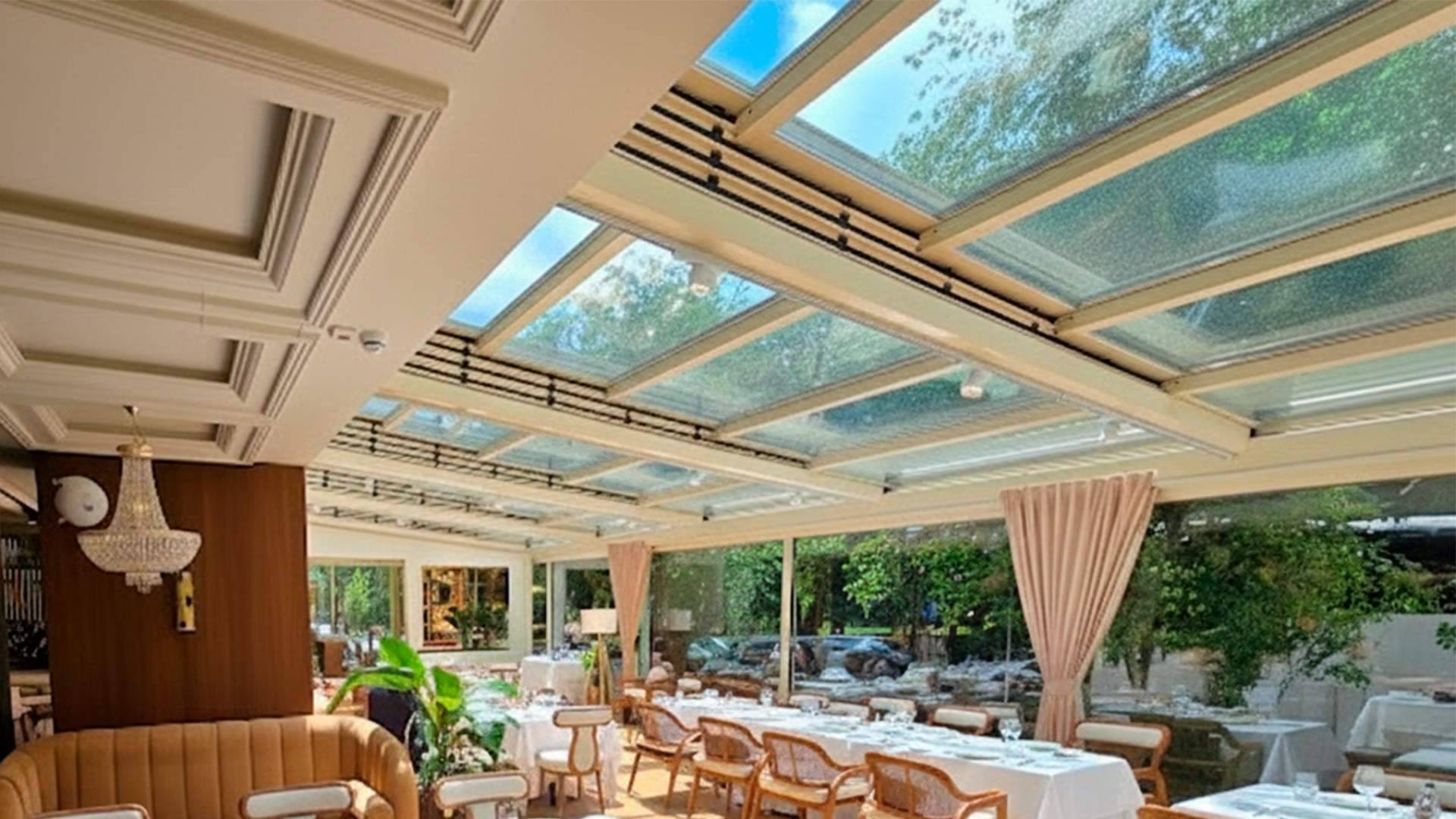 How the Airclos T7003RPT system redefines the architectural envelope through glass retractable roofs